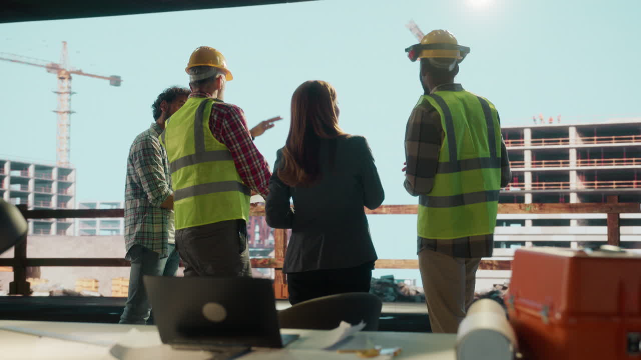 Construction professionals collaborating on a building site