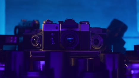 vintage cameras in blue-purple light