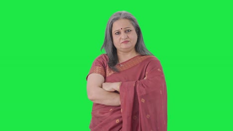 Confident-Indian-old-woman-standing-crossed-hands-Green-screen