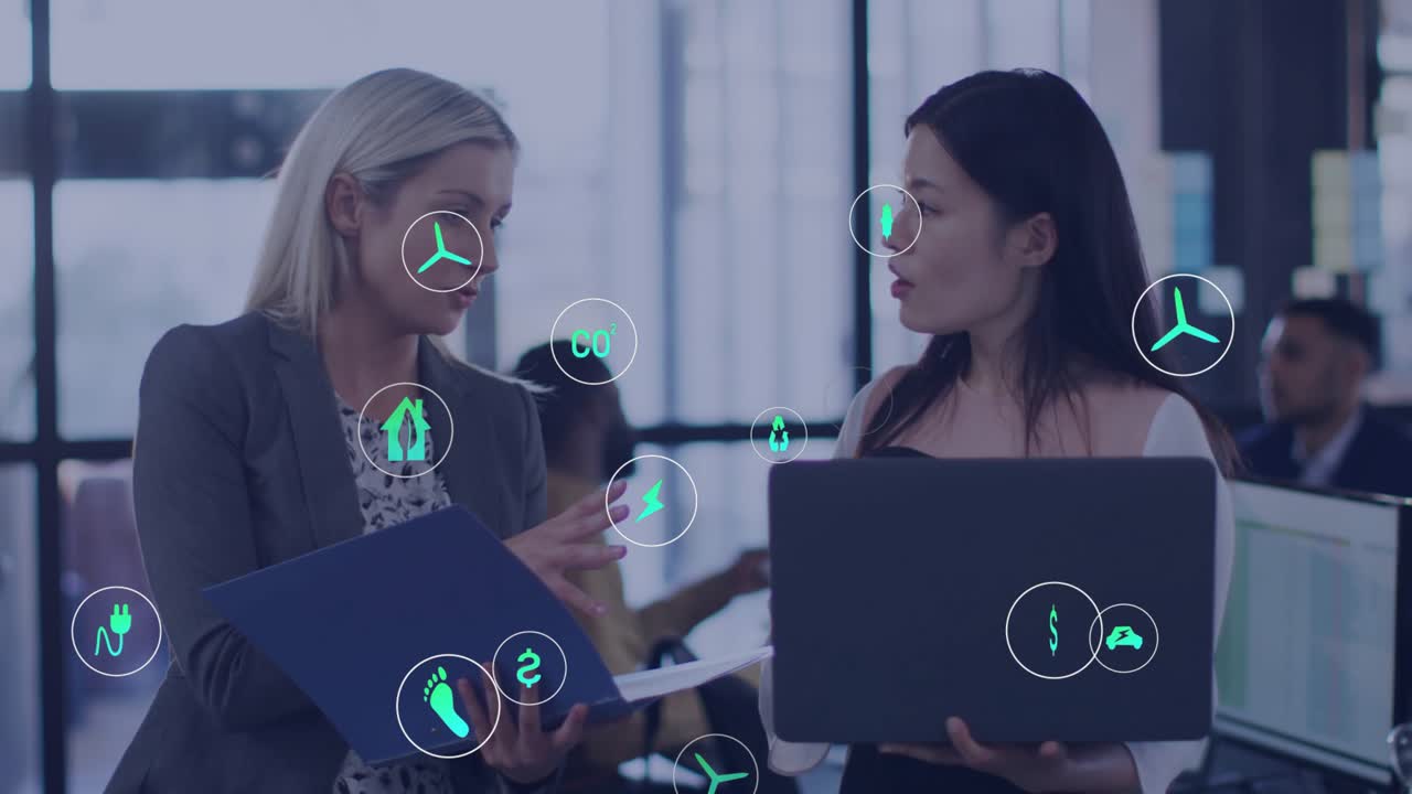 Two professional women flipping folder sparking growth energy icons in business meeting