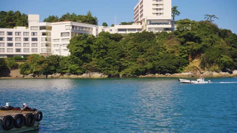 toba port in mie prefecture japan, seaside town as boat passes by