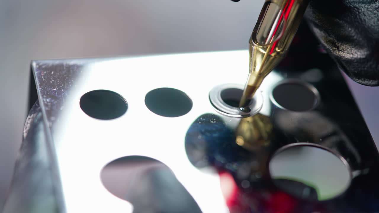 Cosmetologist preparing to applying permanent makeup on eyebrows. Permanent make up. Selective focus and shallow, closeup