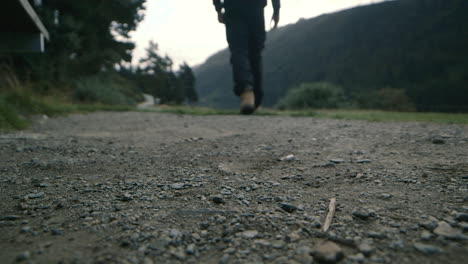 A-man-drops-a-cigarette-butt-on-the-ground-and-stands-on-it-before-walking-away