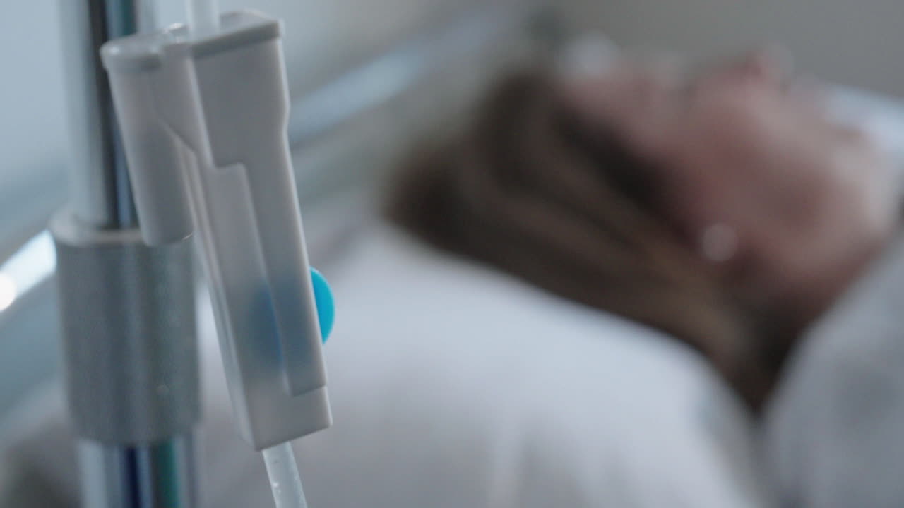 Patient in Hospital Bed with IV