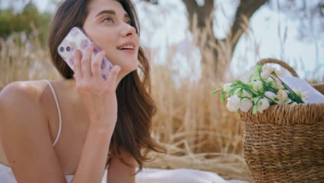 young woman answering phone call rural nature close up. girl start conversation