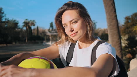 Camerea-zooming-on-caucasian-woman-resting-outdoors.