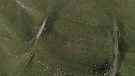 aerial tracking backwards from the top of maiden castle across the western gate ramparts