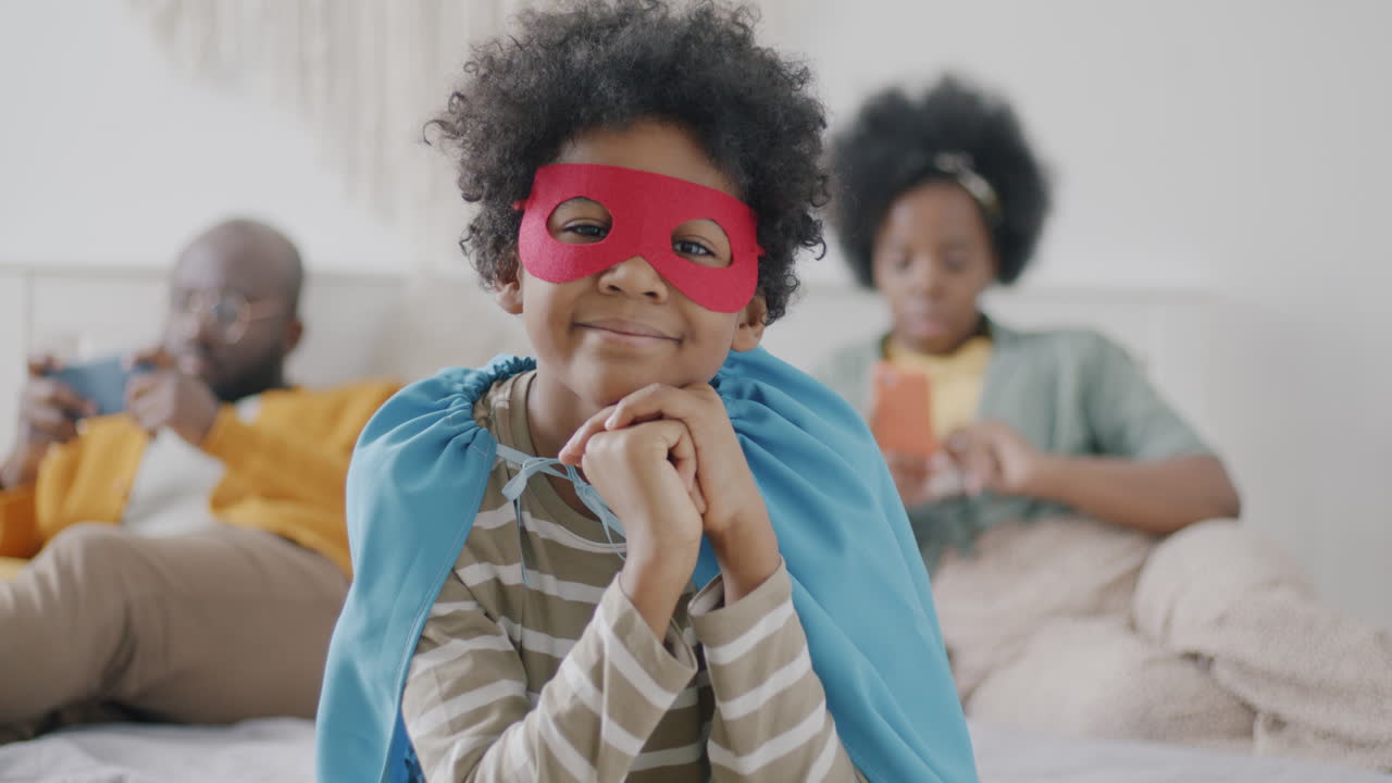 Child Dressed as Superhero with Family