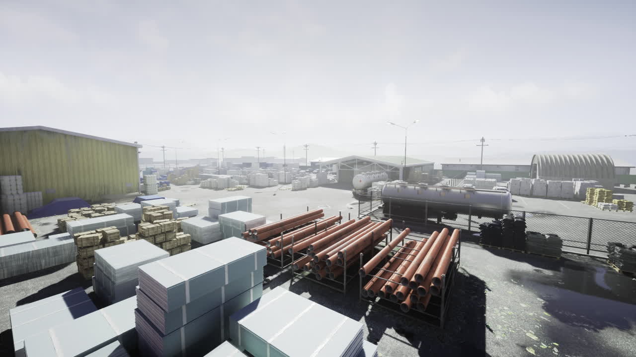 Construction site with stacks of materials under a hazy sky