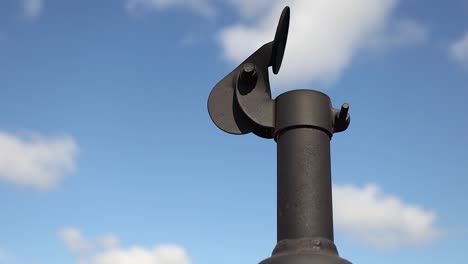 low angle of heavy duty equipment exhaust pipe vibrating against sky