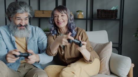 senior couple enjoying a video game session at home