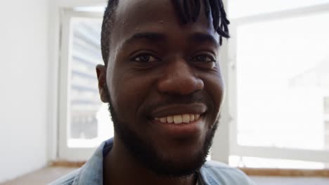 portrait of a man at home smiling