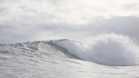 Asian-Filipino-Surfers-Enjoying-Small-Waves-In-Gloomy-Weather