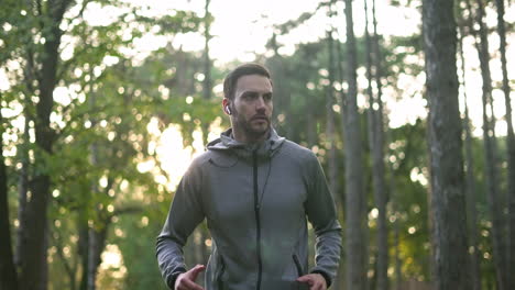 man running in a forest for exercise