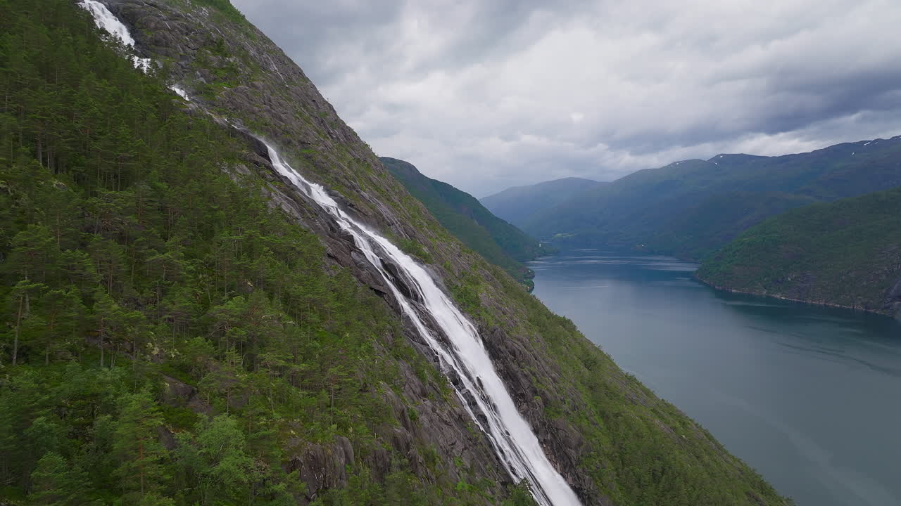 Aerial dolly to Langefoss waterfall in the summer on Norway's stunning west coast