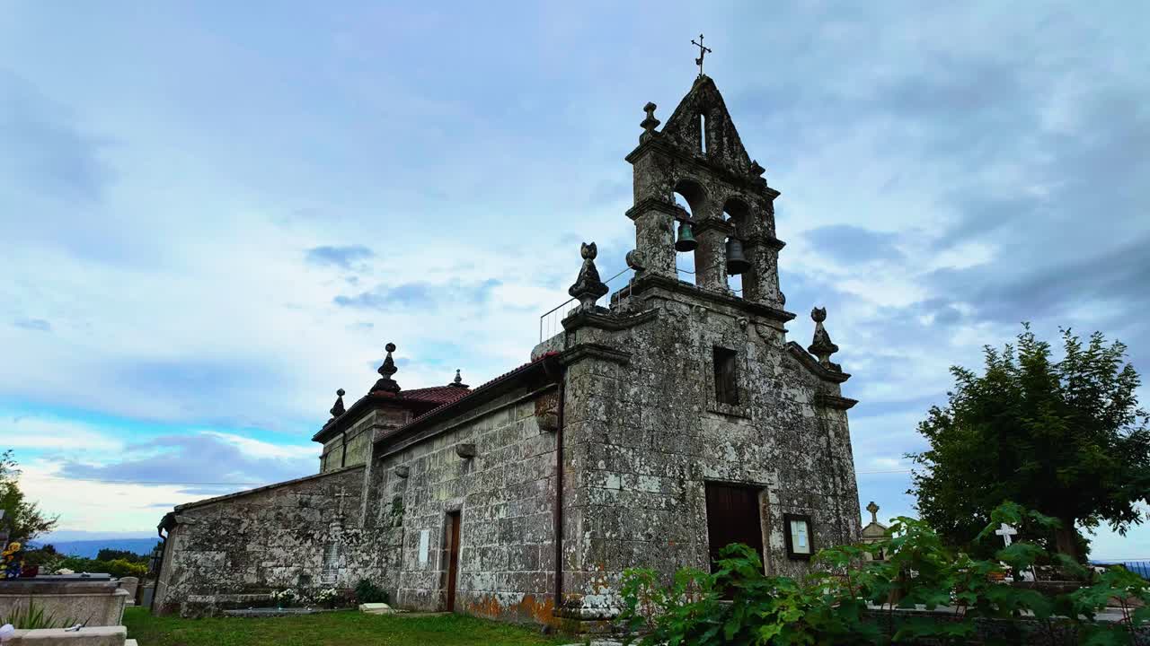 Ancient Stone Church under a Cloudy Sky