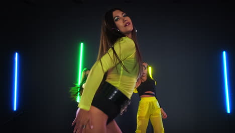 neon dance performance by women
