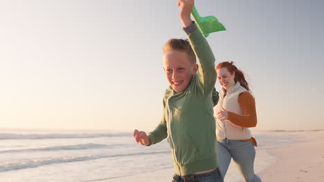 family, smile and play with airplane at beach