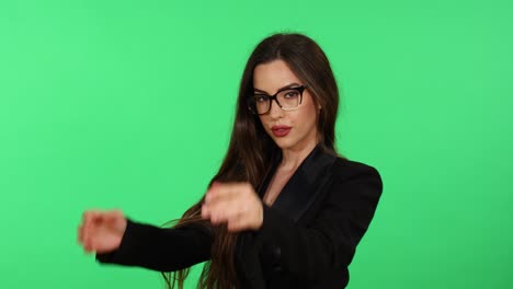 Beautiful-long-hair-brunette-young-woman-in-formal-black-business-office-suit-and-glasses-uses-glossy-lipstick-for-make-up