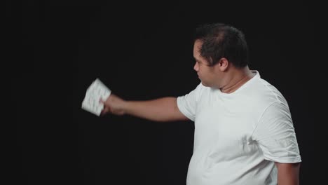 asian magician shows trick with playing cards. manipulation with props. sleight of hand