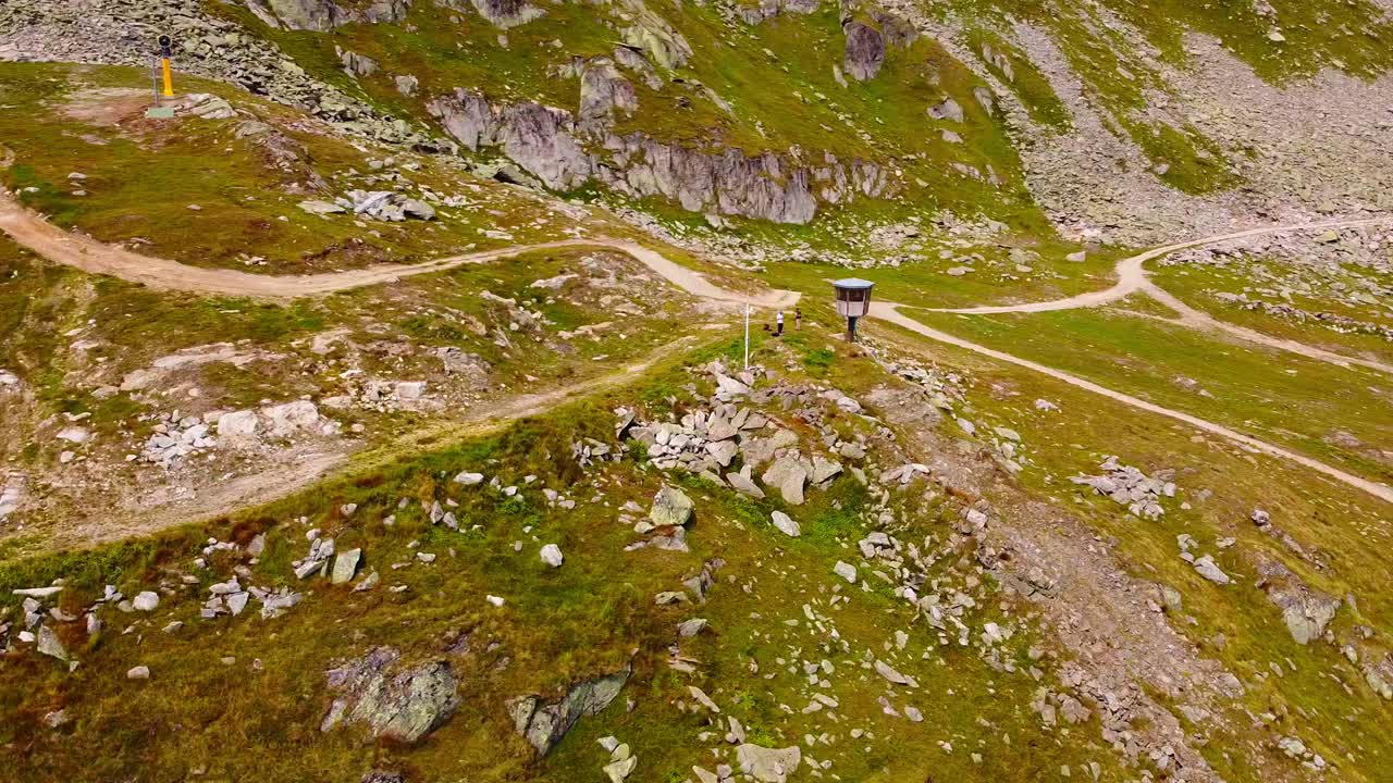 Aerial above beautiful mountain scenery with sharm rocks and hiking trails in the swiss alps mountain landscape