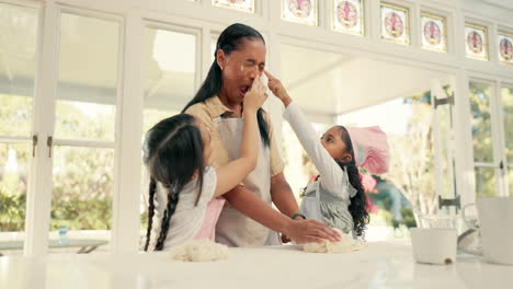 Baking,-dough-and-a-mother-teaching-her-daughters