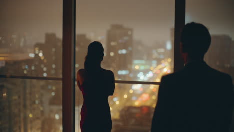 woman silhouette looking night city thinking in contemporary flat back view