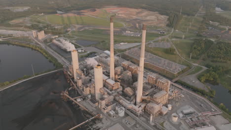 static aerial footage of a power plant on the shores of a lake in north carolina