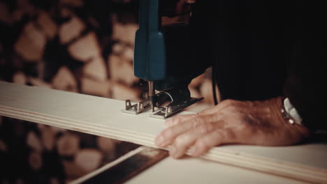 a slow motion of a carpenter cutting wood with a special machine