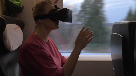 Woman-using-VR-headset-during-train-journey