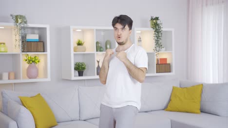 sportsman practicing shadow boxing at home.