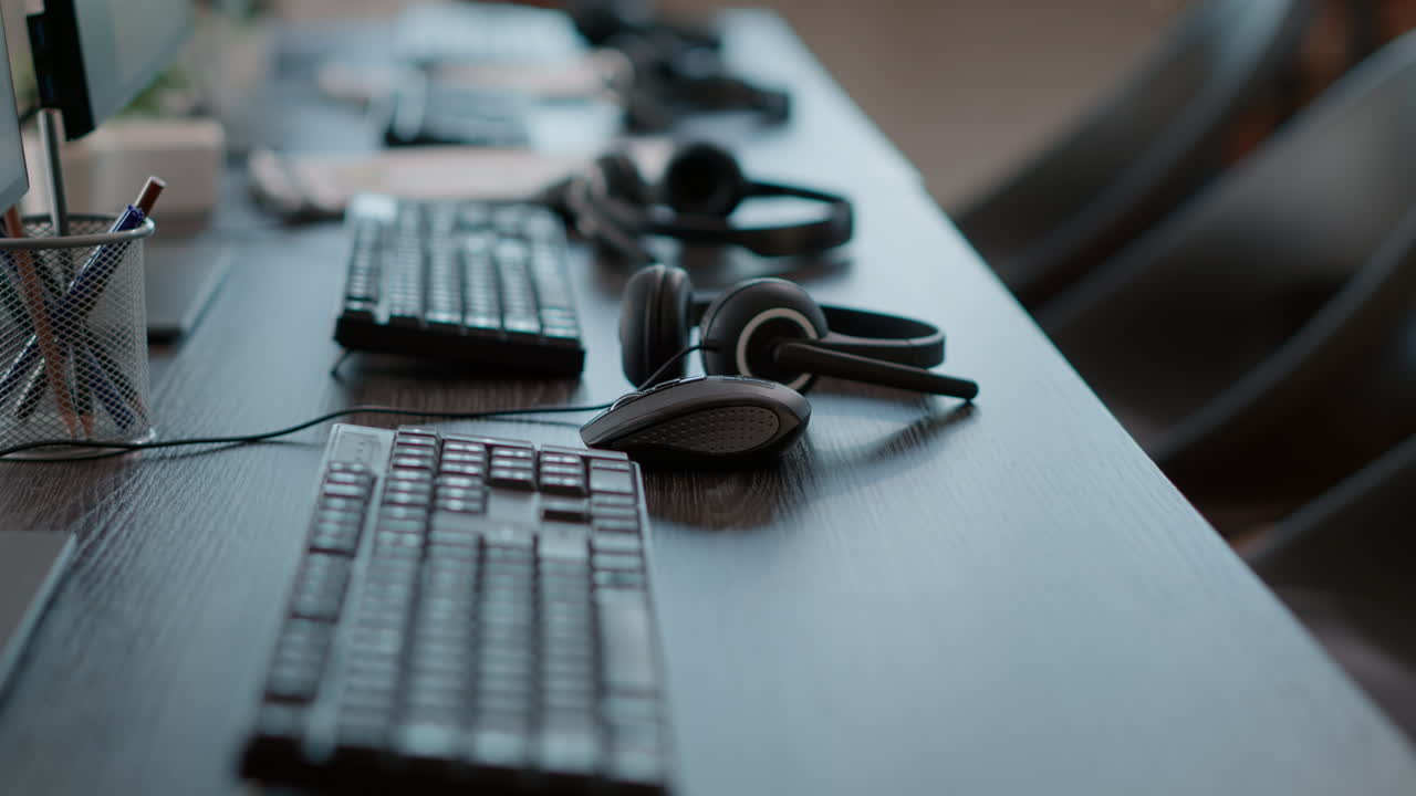 Call center desk with audio headsets and computers