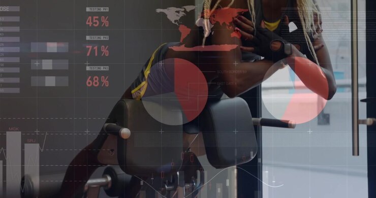 Animation of graphs over african american woman exercising at gym