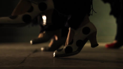 close up gimbal shot of feet doing flamenco tap dancing. low pov