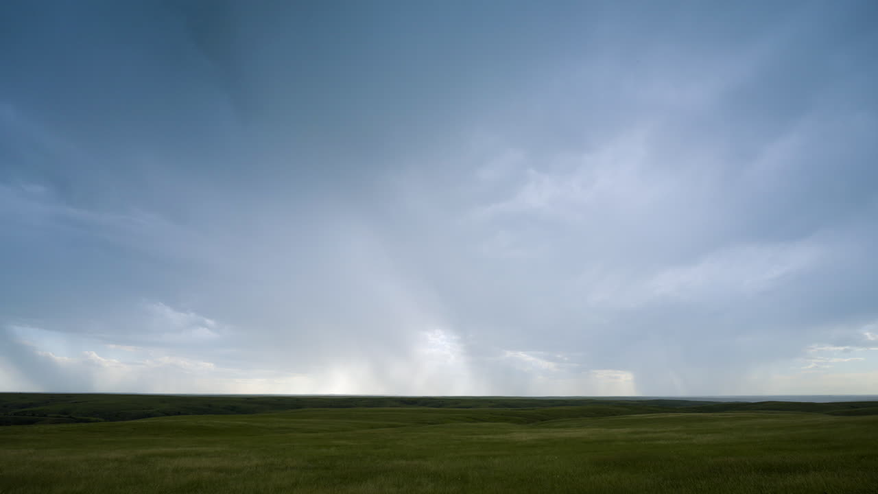 Summer thunderstorm over beautiful green fields lightning strikes