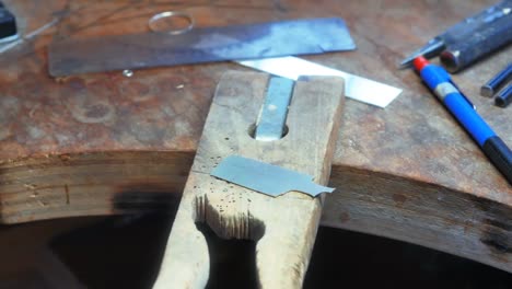 Hands-of-craftswoman-working-in-workshop