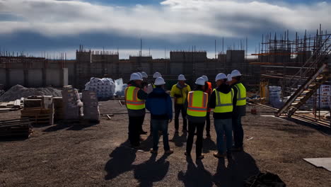 construction workers meeting at a building site