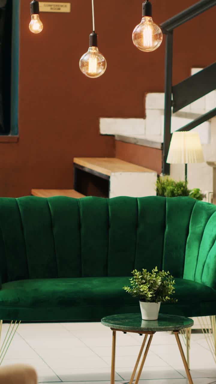 Vertical video Hotel lobby with empty lounge area