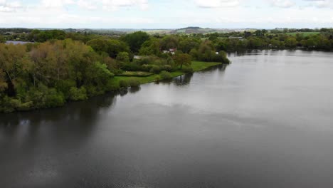 aerial forward and panning right shot of chard reservoir south west england