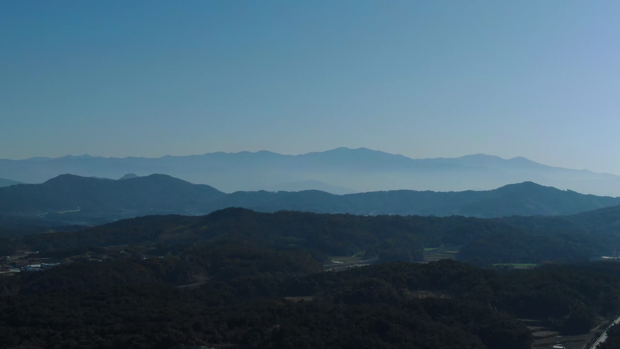 a panoramic view of a peaceful mountain in the distance.