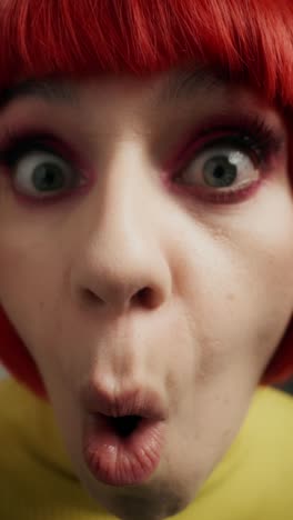 close-up portrait of woman with vibrant makeup and red hair