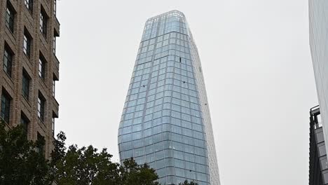 Looking-up-towards-One-Blackfriars-on-a-cloudy-day,-Southwark,-London,-United-Kingdom