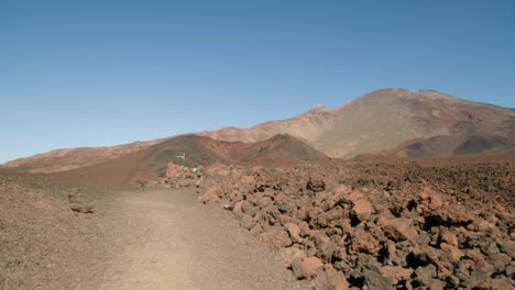 Signpost-bellow-Pico-del-Teide,-rocky-volcanic-landscape,-Teide-Nation-park-on-Tenerife,-Canary-Islandsnds-in-spring