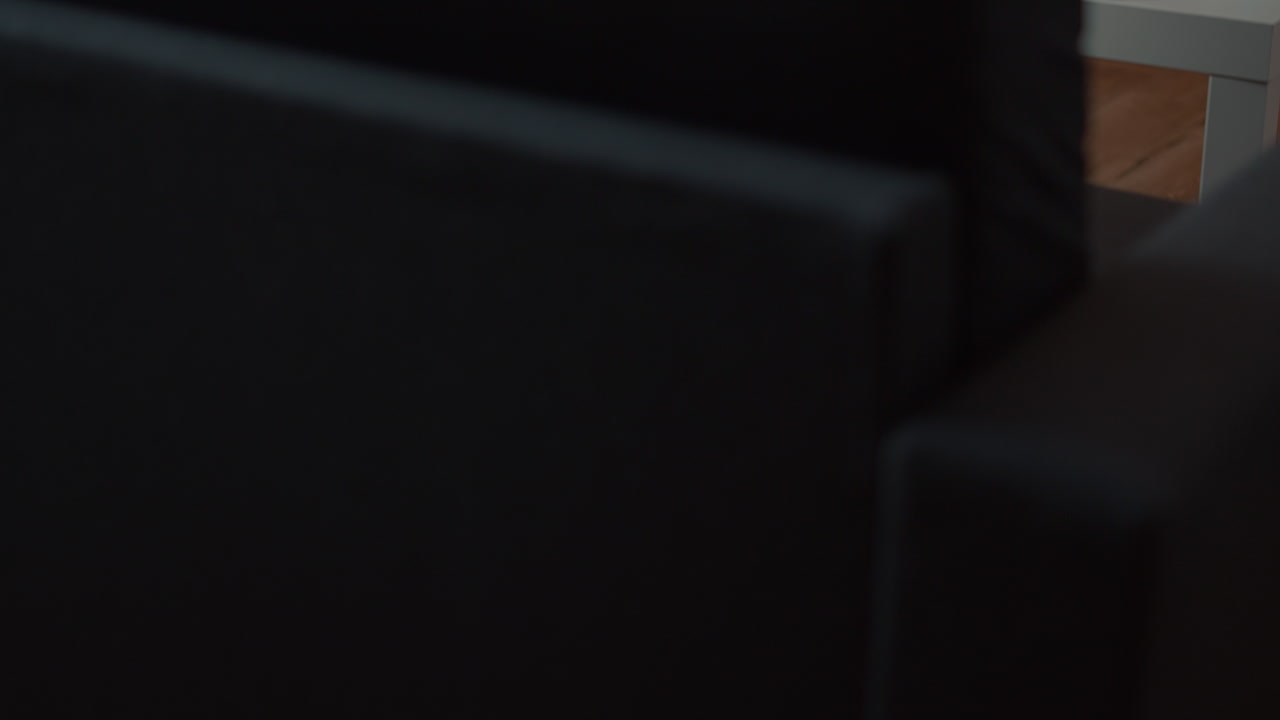 Elderly woman on video call with family using laptop