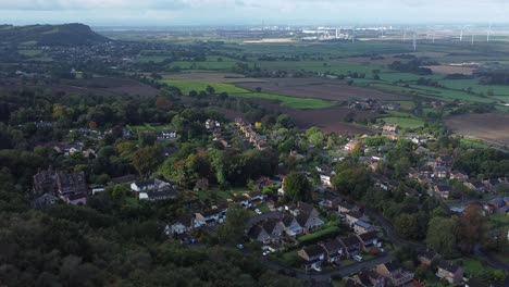 Aerial-view-above-Cheshire-North-England-viewpoint-out-across-Snowdonia-North-Wales-vast-countryside-orbit-left