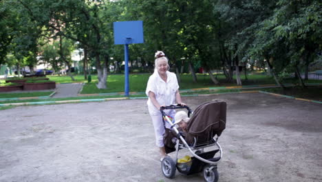 grandmother walks with her grandson in the yard