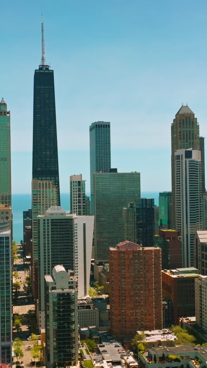 Amazing architecture of modern Chicago city, Illinois, USA. Sunny footage of skyscrapers against blue sky backdrop. Vertical video