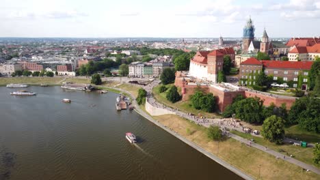 Aerial-of-crowd-of-tourists-visiting-Wawel-Royal-Castle-National-Art-Collection-Museum-on-the-Vistula-River