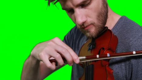 close-up of male musician playing violin