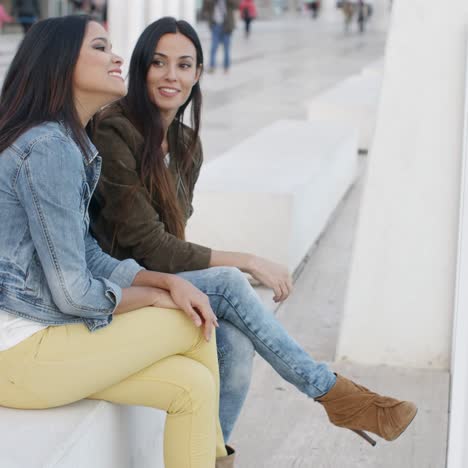 two trendy young women relaxing